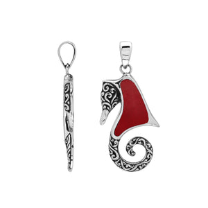 Sterling silver seahorse pendant with coral inlay and Balinese scroll detailing, handmade in Bali for wholesale buyers.