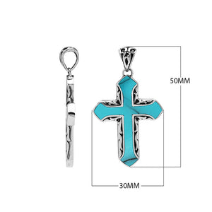 Sterling silver cross pendant with turquoise shell inlay and Balinese scroll detailing, wholesale artisan jewelry.