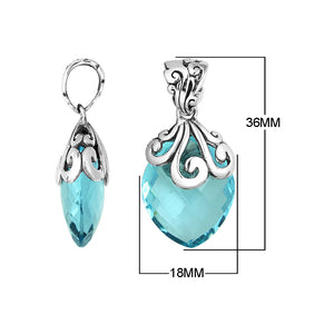 Handcrafted 925 Sterling Silver Blue Topaz Quartz pendant with intricate swirl filigree pattern, mirror-polished surface, and Balinese-inspired marquise shape design for wholesale jewelry suppliers.