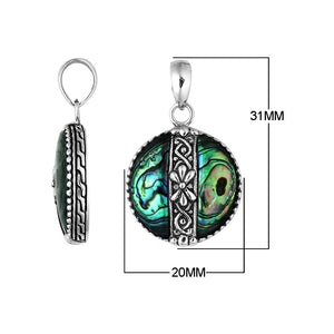 Handcrafted 925 Sterling Silver Abalone Shell round pendant featuring floral center pattern, mirror-polished finish, and iridescent tones with detailed Balinese silver artistry for wholesale buyers.