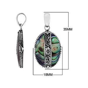 Handcrafted 925 Sterling Silver Abalone Shell oval pendant featuring detailed floral center design, high-gloss mirror finish, and Balinese-inspired craftsmanship for wholesale jewelry catalogs.