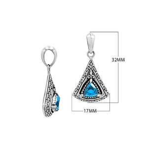 Triangular sterling silver pendant featuring trillion-cut blue topaz quartz with geometric engraving and polished Balinese finish.