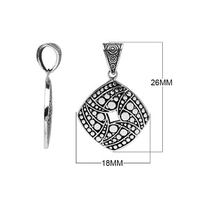 Sterling silver diamond-shaped pendant featuring circular dot engravings, geometric Balinese detailing, and polished oxidized finish.