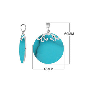 Sterling silver round Turquoise Shell pendant featuring vibrant turquoise blue tones, subtle dark veining, symmetrical floral scrollwork across the upper edge, and a polished tapered silver bail, shown from front and side views.
