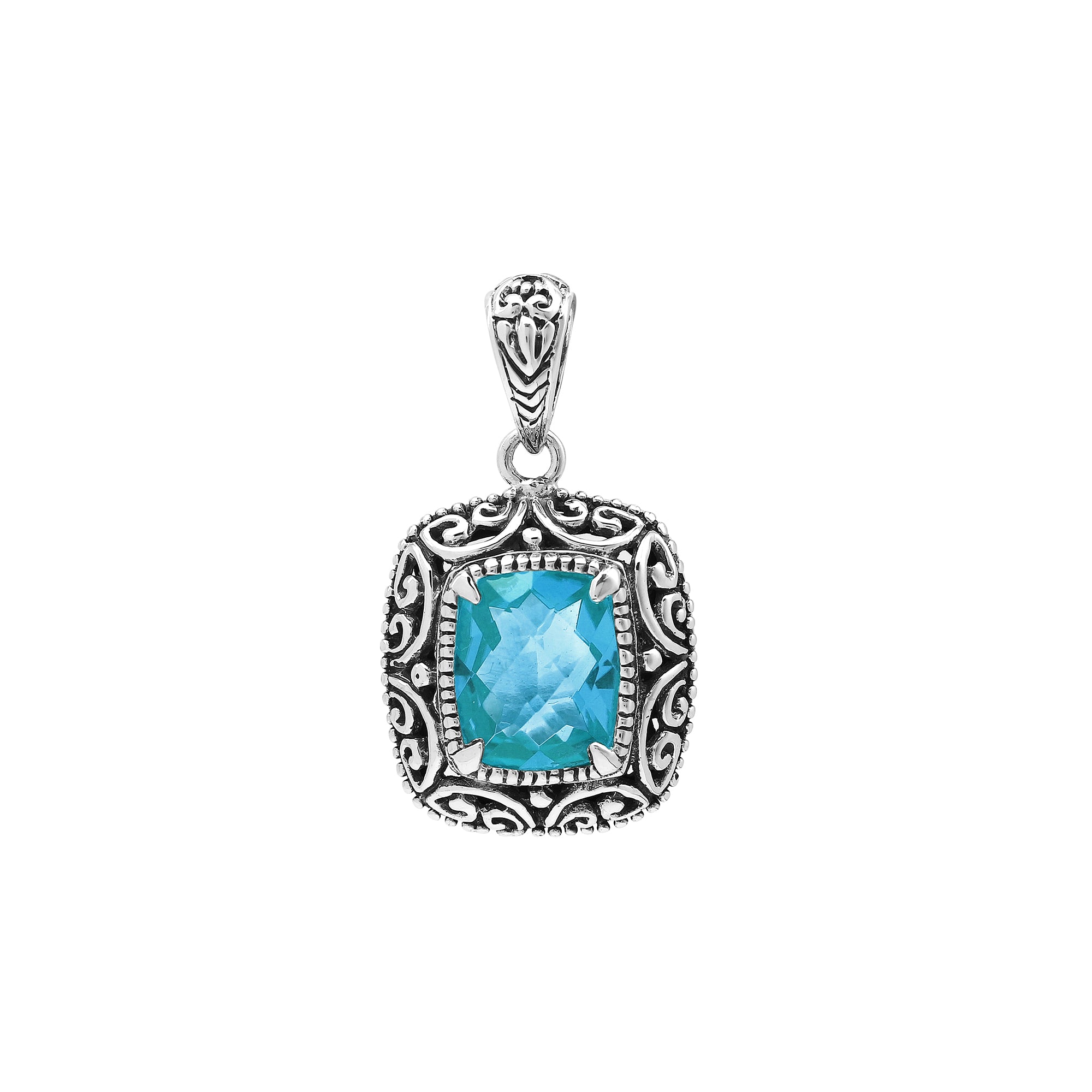 Sterling silver cushion pendant featuring a faceted Blue Topaz Quartz centerpiece accented with intricate Balinese scroll carvings and a polished decorative frame.