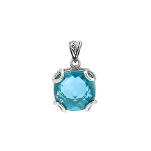 Sterling silver cushion pendant featuring a faceted Blue Topaz Quartz centerpiece secured by artistic prong detailing with traditional Balinese carved accents.
