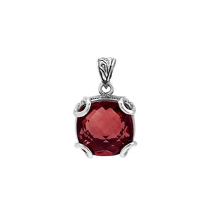 Sterling silver cushion pendant featuring a deep-toned Red Garnet Quartz center secured with artistic prong detailing and traditional Balinese carved accents.