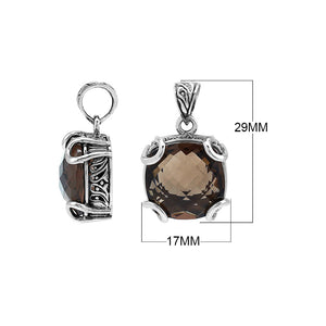 Sterling silver cushion pendant featuring a faceted Smokey Quartz centerpiece secured with decorative prong detailing and traditional Balinese carved ornamentation.