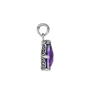 Sterling silver pear-shaped pendant featuring a faceted Amethyst Quartz centerpiece with polished prong-setting and traditional Balinese carved ornamental accents.