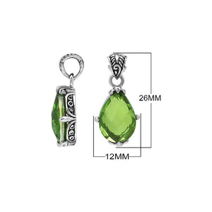 Sterling silver pear-shaped pendant featuring a faceted Peridot Quartz centerpiece with polished prong-setting and detailed Balinese carved ornamental accents.