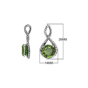 Sterling silver twisted loop pendant featuring a round Peridot Quartz centerpiece with carved Balinese engraving and polished artistic round design.