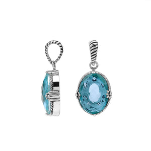 Sterling silver oval pendant with faceted Blue Topaz Quartz and rope-accent Balinese detail.