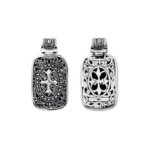 A wholesale Silver Overlay Over Copper rectangular pendant featuring deep oxidized Balinese scrollwork, raised detailing, polished overlay texture, and traditional craftsmanship ideal for bulk jewelry buyers.