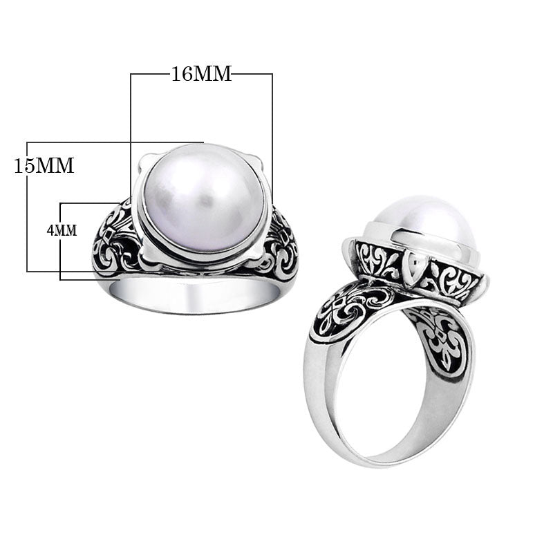 Wholesale sterling silver Bali ring with white Mabe Pearl cabochon and handcrafted filigree design – artisan bulk jewelry.