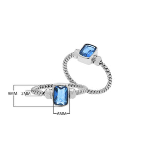 Wholesale sterling silver twisted band ring with rectangular-cut Blue Topaz Quartz, handcrafted artisan jewelry in bulk for retailers and resellers.