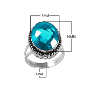 Wholesale sterling silver ring with faceted oval Blue Topaz Quartz, Balinese beaded border design – bulk handcrafted statement jewelry.