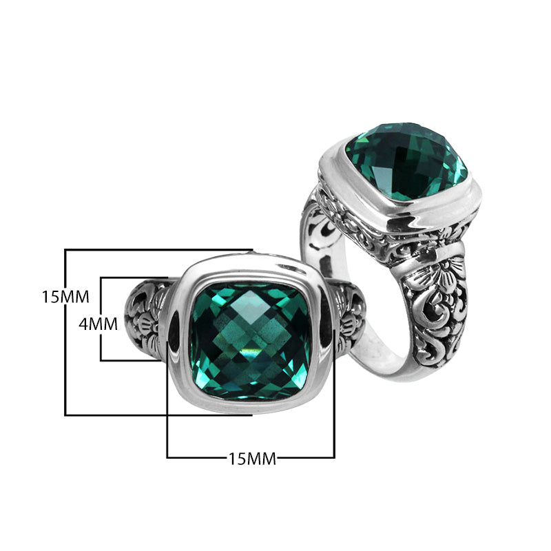 Sterling silver ring with cushion-cut Green Quartz and Balinese scroll carvings.