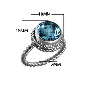 Sterling silver ring with a round Blue Topaz Quartz and rope-style band design.