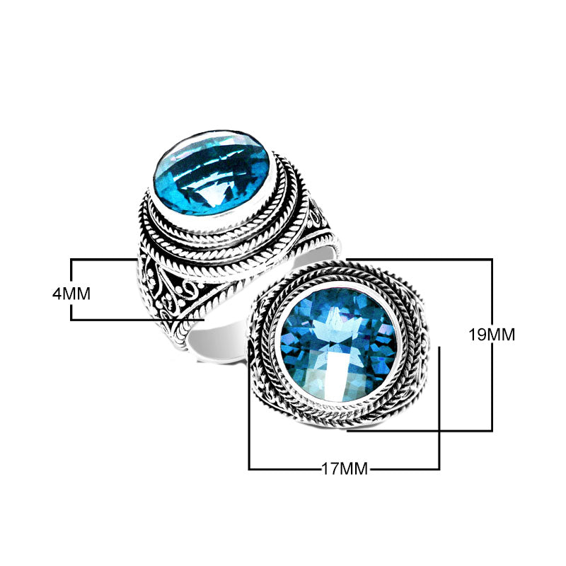 Sterling silver handcrafted Bali ring with round Blue Topaz Quartz and rope scroll design.