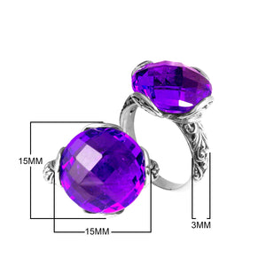 Sterling silver ring with faceted round Blue Topaz Quartz and Balinese scrollwork handcrafted in Bali.