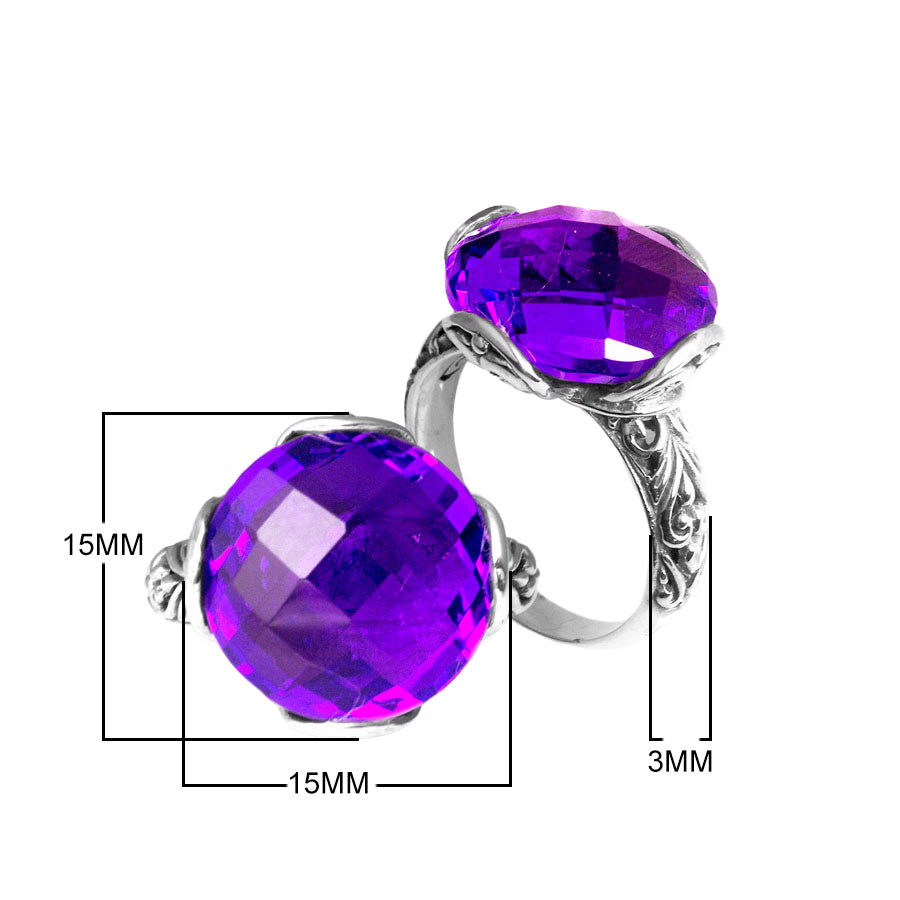 Sterling silver ring with faceted round Blue Topaz Quartz and Balinese scrollwork handcrafted in Bali.