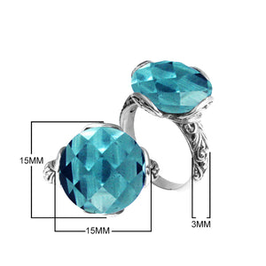 Sterling silver ring with faceted round Blue Topaz Quartz and Balinese scrollwork handcrafted in Bali.