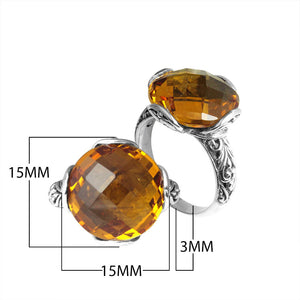 Sterling silver ring with faceted round Citrine Quartz and Balinese scrollwork, handcrafted in Bali.