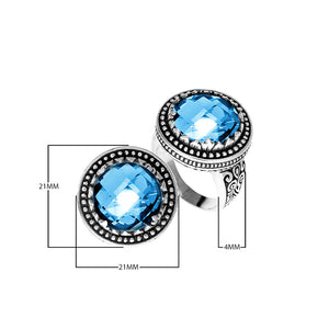 Sterling silver ring with faceted Blue Topaz Quartz, beaded halo, and Balinese carvings handcrafted in Bali.