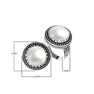 Sterling silver handcrafted Bali ring with Mother of Pearl cabochon and beaded halo design.