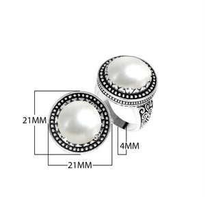 Sterling silver handcrafted Bali ring with Mother of Pearl cabochon and beaded halo design.