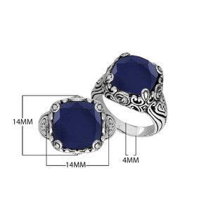 Sterling Silver ornate statement ring with Blue Sapphire and intricate Bali-inspired detailing.