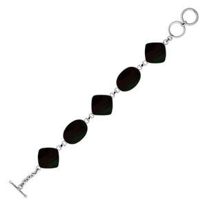 Sterling silver bracelet with oval and cushion black shell links, polished finish.