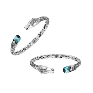 Sterling Silver Dragon Head Bangle with Blue Topaz Quartz handcrafted in Bali featuring intricate filigree and oxidized detailing.