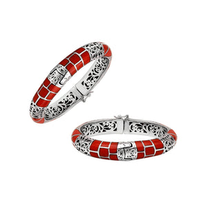 Sterling silver hinged bangle with red coral inlay and intricate filigree design handcrafted in Bali.