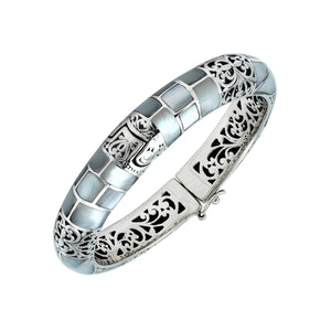 Sterling silver hinged bangle with mother of pearl inlay and intricate filigree design handcrafted in Bali.