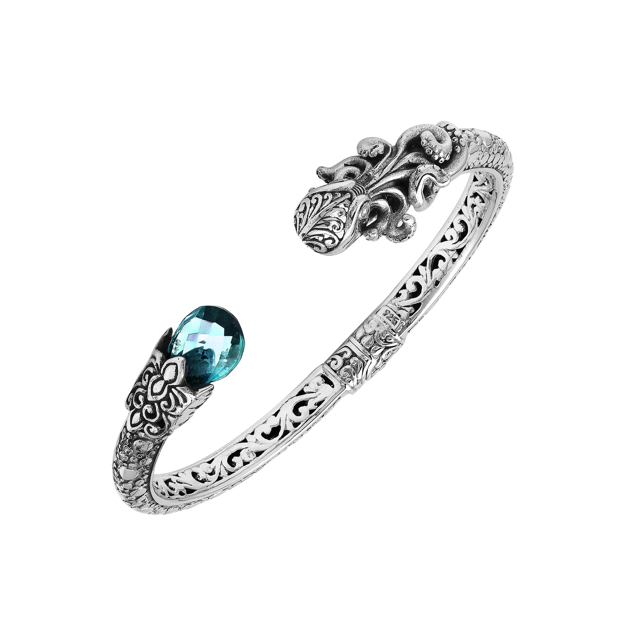 A wholesale sterling silver octopus-themed bangle featuring blue topaz quartz, detailed tentacle carvings, oxidized textures, and a secure hinge lock ideal for bulk jewelry purchases.