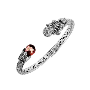 Sterling silver dragon head cuff bangle with garnet quartz ends and floral carvings handcrafted in Bali.