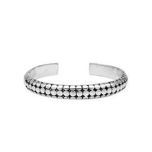 Sterling silver medium bangle featuring polished dot pattern detailing, oxidized accents, and a secure hinge lock crafted for reliable and stylish wholesale jewelry selections.