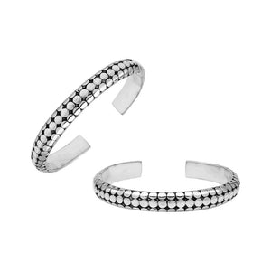 Sterling silver medium bangle featuring polished dot pattern detailing, oxidized accents, and a secure hinge lock crafted for reliable and stylish wholesale jewelry selections.