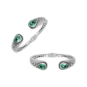 Wholesale sterling silver hinge-lock cuff with green quartz teardrop stones and Balinese engravings.