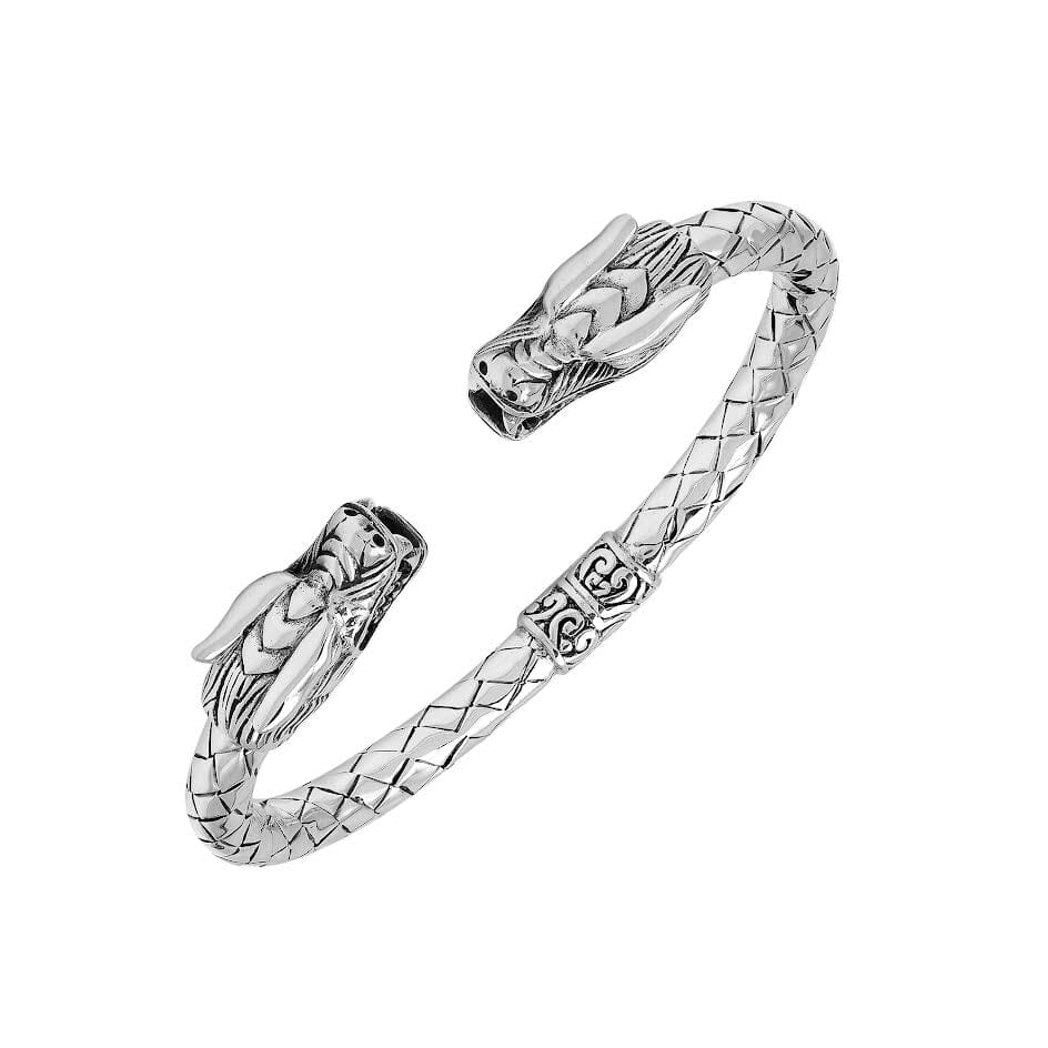 Wholesale sterling silver dragon head cuff bangle featuring detailed carvings, textured patterning, and a secure hinge-lock mechanism designed for reliable and consistent bulk inventory.