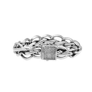 A wholesale sterling silver woven chain bracelet featuring a textured Cubic Zirconia push clasp, mirror-polished heavy links, and durable craftsmanship designed for premium bulk jewelry collections.