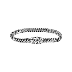 A wholesale sterling silver compact woven bracelet with an etched push clasp, featuring polished and oxidized detailing crafted for high-quality bulk jewelry collections.