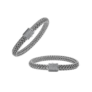 A wholesale sterling silver broad woven bracelet featuring a CVD Diamond-studded push clasp, polished and oxidized detailing, and bold craftsmanship designed for premium bulk jewelry collections.