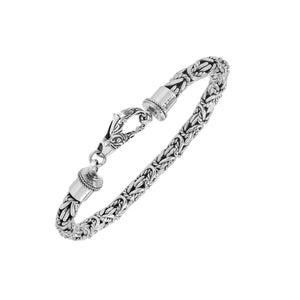 Wholesale sterling silver bracelet featuring Balinese woven wheat-link design with detailed lobster clasp handcrafted in Bali.