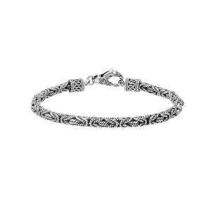 Sterling silver braided wheat chain bracelet with oxidized finish and ornate hook clasp handcrafted in Bali.
