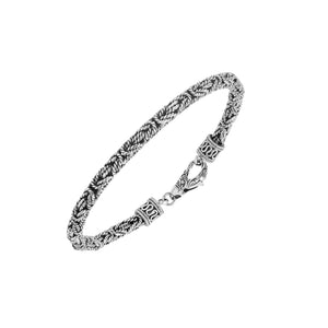 Sterling silver braided wheat chain bracelet with oxidized finish and ornate hook clasp handcrafted in Bali.