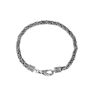 Sterling silver braided wheat chain bracelet with oxidized finish and ornate hook clasp handcrafted in Bali.