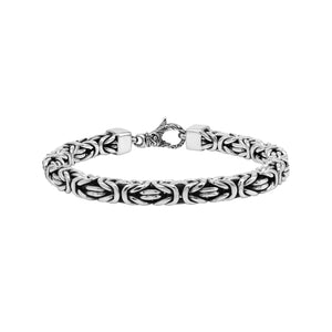 Wholesale sterling silver bracelet featuring a bold 7MM Balinese woven chain with oxidized accents and a secure lobster lock designed for premium bulk catalogs.