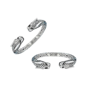 Wholesale sterling silver phoenix cuff bangle featuring Abalone Shell accents, intricate Balinese scroll engraving, and a secure hinge lock for detailed artisan presentation.